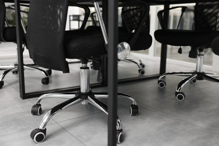 Comfortable office chairs and tables in meeting room, closeupの写真素材