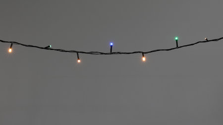 Beautiful color Christmas lights on gray backgroundの写真素材