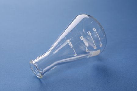 One flask on blue background. laboratory glassware