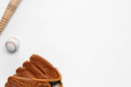 Baseball glove, bat and ball on white background, flat lay. Space for textの写真素材
