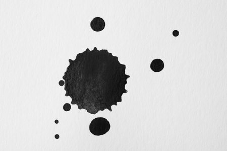 Blots of black ink on white background, flat layの写真素材