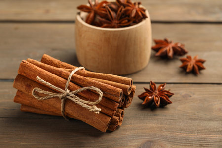 Cinnamon sticks and star anise on wooden table, closeupの写真素材