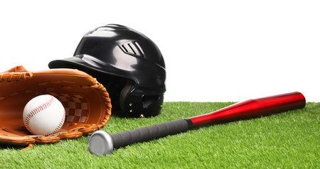 Baseball bat, ball, batting helmet and glove on artificial grass against white backgroundの写真素材