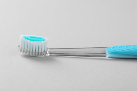 One plastic toothbrush on light background, closeupの写真素材