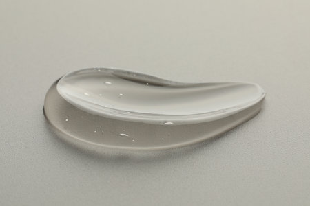 Sample of clear cosmetic gel on light gray background, closeupの写真素材