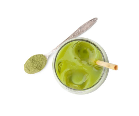 Glass of tasty iced matcha latte and spoon with powder isolated on white, top viewの写真素材