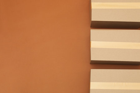 Cardboard boxes on brown background, flat lay. Space for textの写真素材
