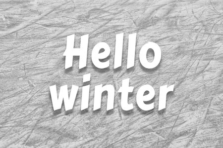 Hello winter inscription on frozen ice skating surfaceの写真素材