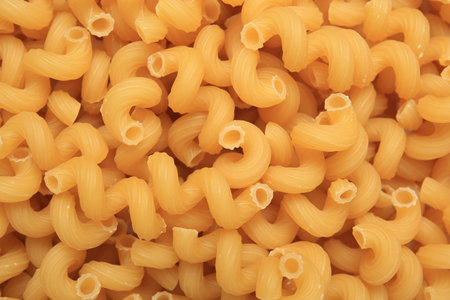 Raw cavatappi pasta as background, top viewの写真素材