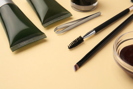 Eyebrow henna and tools on beige background, closeupの写真素材