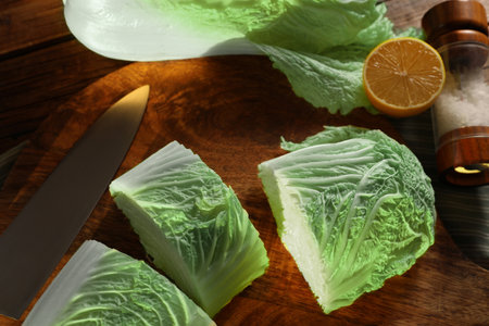 Fresh Chinese cabbage, knife, salt and lemon on table, top viewの写真素材