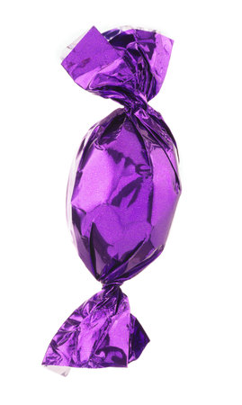 Candy in purple wrapper isolated on whiteの写真素材