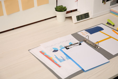 Business process planning and optimization. Documents with different types of graphs and stationery...