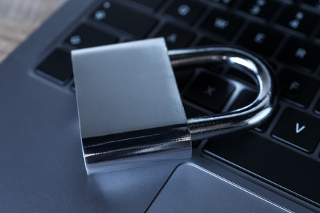 Cyber security. Laptop with padlock on table, closeupの写真素材