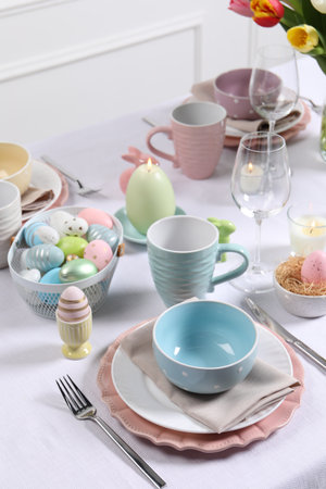 Festive table setting with painted eggs. Easter celebrationの写真素材