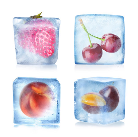 Frozen food. Different fruits in ice cubes isolated on white, setの写真素材