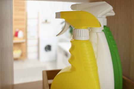 Spray detergents in laundry room, closeup. Space for textの写真素材