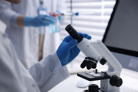 Scientists working with samples in laboratory, closeup. Medical research