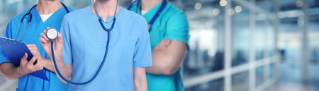 Doctors and nurse in hospital, closeup. Banner design with space for textの写真素材