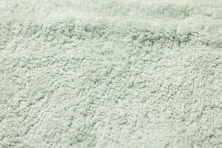 Texture of soft light green fabric as background, closeupの写真素材
