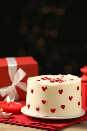 Bento cake, candles and gift box on wooden table. St. Valentine's day surpriseの写真素材