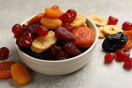 Mix of delicious dried fruits on gray table, closeupの写真素材