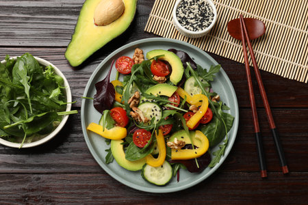 Balanced diet and vegetarian foods. Plate with different delicious products on wooden table, flat layの写真素材