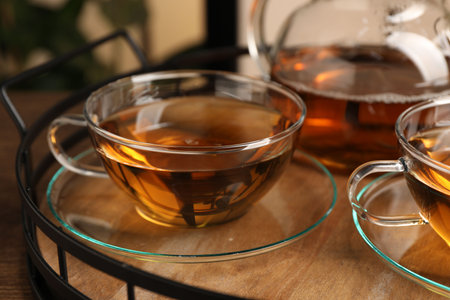 Aromatic tea in glass cups on wooden table, closeupの写真素材
