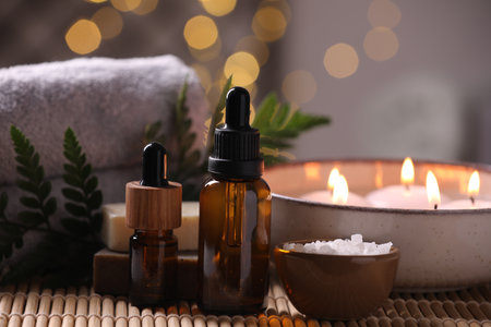 Beautiful composition with different spa products on table against blurred lights, closeupの写真素材