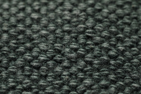 Texture of soft gray knitted fabric as background, closeup
