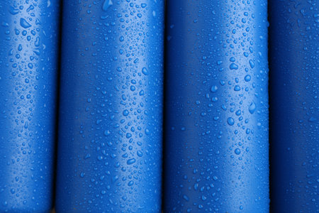 Energy drinks in wet cans as background, top viewの写真素材