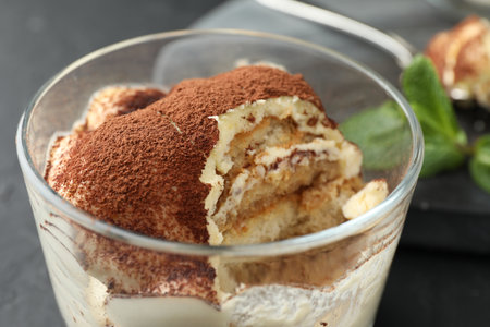 Delicious tiramisu in glass on table, closeupの写真素材