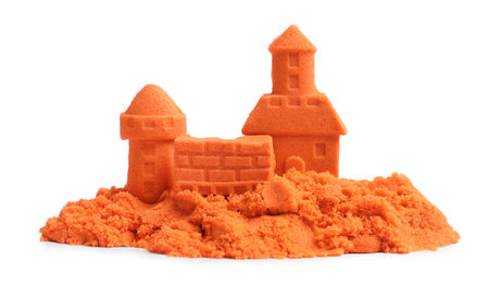Castle figures made of orange kinetic sand isolated on whiteの写真素材