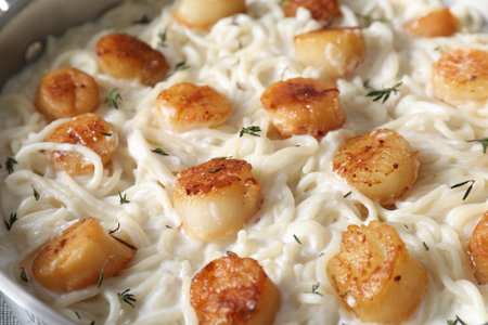 Delicious scallop pasta as background, closeup viewの写真素材