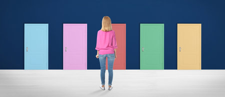 Woman standing in front of many colorful doors, back view. Banner design