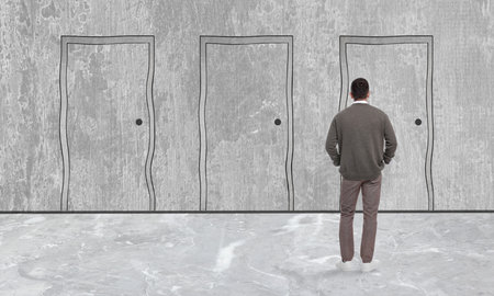 Man standing in front of drawn doors, back view. Banner designの写真素材