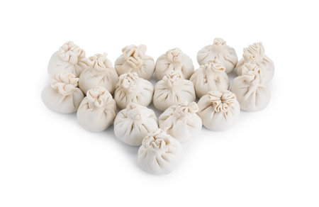 Many uncooked khinkali (dumplings) isolated on white. Georgian cuisineの写真素材