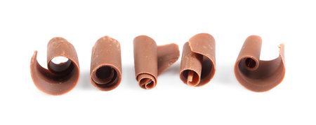 Many delicious chocolate shavings isolated on whiteの写真素材