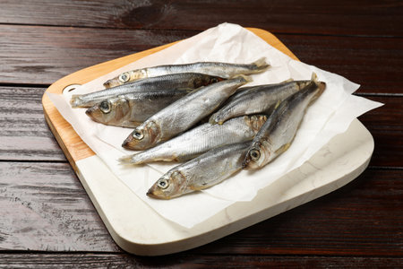 Fresh raw sprats on wooden table, closeupの写真素材