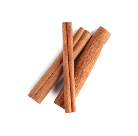 Cinnamon sticks isolated on white, top viewの写真素材