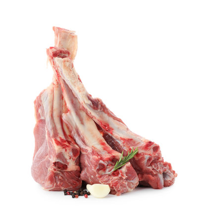 Pieces of raw beef meat and spices isolated on whiteの写真素材