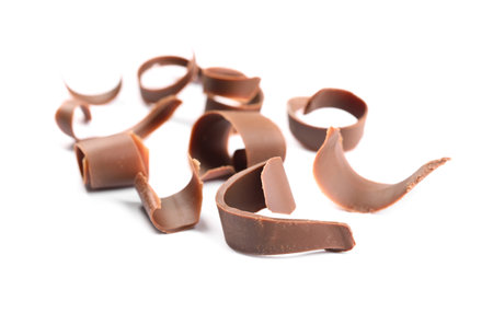 Many delicious chocolate shavings isolated on whiteの写真素材