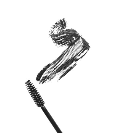 Smear of mascara and applicator isolated on white, top viewの写真素材
