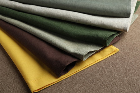 Many different color fabrics on brown clothの写真素材