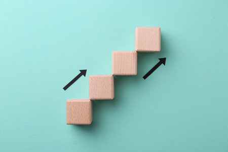 Business process organization and optimization. Scheme with wooden figures and arrows on light blue...