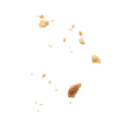 Pieces of crumbled cracker isolated on whiteの写真素材
