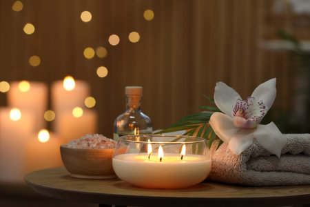 Composition with different spa products and orchid flower on wooden tableの写真素材