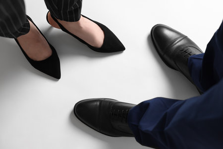 Businesswoman and businessman on white background, above viewの写真素材