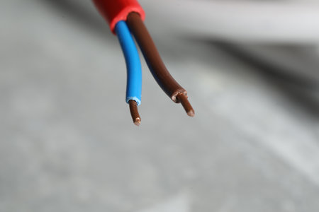 Colorful electrical wire on gray background, closeup. Space for textの写真素材
