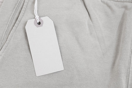 Cardboard tag on pants, top view. Space for textの写真素材